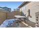 View of a cozy backyard with a table and fence at 7203 W Pacific Ave, Lakewood, CO 80227