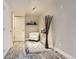Cozy finished basement with a white chair, decorative rug, and rustic decor, offering a relaxing space at 7203 W Pacific Ave, Lakewood, CO 80227