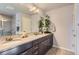 Bright bathroom with double sinks and decorative bamboo accents at 7203 W Pacific Ave, Lakewood, CO 80227