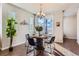 Bright dining area features a round table with seating for four and natural light at 7203 W Pacific Ave, Lakewood, CO 80227