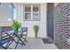 Cozy front porch perfect for enjoying the outdoors and entertaining guests at 7203 W Pacific Ave, Lakewood, CO 80227