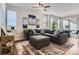Cozy living room showcases a large sectional sofa, patterned rug, and modern decor at 7203 W Pacific Ave, Lakewood, CO 80227