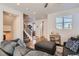 Comfortable living room with sectional sofa and access to entry at 7203 W Pacific Ave, Lakewood, CO 80227