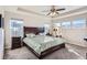 Bright main bedroom with large windows and a ceiling fan at 7203 W Pacific Ave, Lakewood, CO 80227