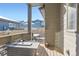 Inviting outdoor patio with a gas fire pit, providing a cozy space for entertaining and relaxing in the fresh air at 7203 W Pacific Ave, Lakewood, CO 80227