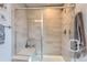 Elegant glass enclosed shower with a built in bench at 7203 W Pacific Ave, Lakewood, CO 80227