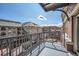 Private balcony overlooking a serene courtyard offering unobstructed skyline views at 1950 N Logan St # 411, Denver, CO 80203