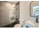 Stylish bathroom features a glass enclosed shower and contemporary vanity with designer mirror at 1950 N Logan St # 411, Denver, CO 80203