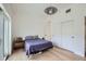 Bright bedroom with light hardwood floors, modern lighting, and a minimalist design at 1950 N Logan St # 411, Denver, CO 80203