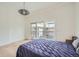 Cozy bedroom with hardwood floors, large windows, and modern light fixture at 1950 N Logan St # 411, Denver, CO 80203