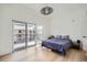 Sunlit bedroom features a large window, hardwood floors, and contemporary style at 1950 N Logan St # 411, Denver, CO 80203
