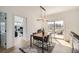 Well-lit dining room with access to an outdoor balcony and adjacent office space at 1950 N Logan St # 411, Denver, CO 80203