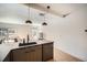 Modern kitchen features stainless steel appliances, stone countertops and open floor plan at 1950 N Logan St # 411, Denver, CO 80203