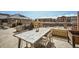 Outdoor patio area with a rustic table, seating, and decor, perfect for outdoor dining and relaxation at 1950 N Logan St # 411, Denver, CO 80203