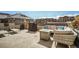 Inviting rooftop patio with comfortable seating and a built-in barbecue area at 1950 N Logan St # 411, Denver, CO 80203