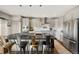 Open kitchen with island, stainless steel appliances, and sleek cabinetry at 8872 E 47Th Ave, Denver, CO 80238
