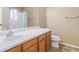 A well-lit bathroom features a spacious vanity area with a single sink and a toilet at 9032 Gale Blvd # 1, Thornton, CO 80260