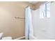 Bright bathroom with tile flooring, tile shower with curtain, and natural light at 9032 Gale Blvd # 1, Thornton, CO 80260