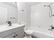 A clean bathroom with a shower and bathtub combination, toilet, and sink with a vanity at 9032 Gale Blvd # 1, Thornton, CO 80260