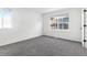 Bright bedroom with neutral carpet, and natural light from two windows at 9032 Gale Blvd # 1, Thornton, CO 80260