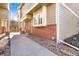 Charming townhouse with a blend of brick and siding and a walkway to the entrance at 9032 Gale Blvd # 1, Thornton, CO 80260