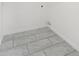 Neat laundry area with tiled floors and pristine white walls, ready for appliance hookups at 9032 Gale Blvd # 1, Thornton, CO 80260