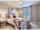 Cozy bedroom featuring soft lighting, comfortable bedding, and a calming color scheme at 4545 S Monaco St # 436, Denver, CO 80237