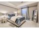 Serene bedroom with neutral tones, soft natural light and an inviting, comfortable bed at 4545 S Monaco St # 436, Denver, CO 80237