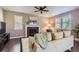 Comfortable living room with a fireplace, plush sofa, and large windows, creating a cozy atmosphere at 4545 S Monaco St # 436, Denver, CO 80237