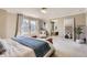 Large primary bedroom with walk-in shower, soaking tub, and natural light at 4545 S Monaco St, Denver, CO 80237