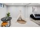 Playful basement area featuring a ' teepee, modern furnishings, and a cozy atmosphere at 7350 Dale Ct, Westminster, CO 80030