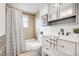 Well-lit bathroom featuring a vanity, modern fixtures, and a shower-tub combination at 7350 Dale Ct, Westminster, CO 80030