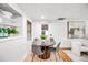 Cozy dining area with a round table, modern chairs, and neutral decor at 7350 Dale Ct, Westminster, CO 80030