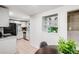 Well-lit kitchen with modern appliances, white cabinetry, and decorative display shelves at 7350 Dale Ct, Westminster, CO 80030