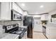 Functional kitchen with modern appliances, granite countertops, and ample cabinet space at 7350 Dale Ct, Westminster, CO 80030