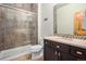 Well-lit bathroom with shower, modern vanity, and neutral decor at 12161 S Leaning Pine Ct, Parker, CO 80134