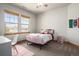 Bedroom featuring two windows, carpet flooring and desk at 12161 S Leaning Pine Ct, Parker, CO 80134