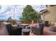 Outdoor deck with comfortable seating, dining table, and expansive tree views at 12161 S Leaning Pine Ct, Parker, CO 80134