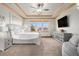 Serene main bedroom with soft lighting, neutral tones, and backyard views at 12161 S Leaning Pine Ct, Parker, CO 80134