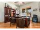 Well-appointed home office featuring a large desk, built-in bookshelves, and natural light at 12161 S Leaning Pine Ct, Parker, CO 80134