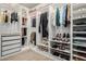 Organized walk-in closet with custom shelving, hanging rods, drawers, and shoe racks at 12161 S Leaning Pine Ct, Parker, CO 80134