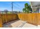 Private back patio with brick pavers and a wooden fence, perfect for outdoor relaxation at 2557 S Dover St # 30, Lakewood, CO 80227