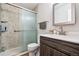 Bathroom featuring a glass-enclosed shower, modern vanity and fixtures at 2557 S Dover St # 30, Lakewood, CO 80227