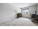 Bedroom with carpet, a window providing natural light, and space for a desk at 2557 S Dover St # 30, Lakewood, CO 80227