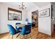 Dining area features seating for four and open to kitchen, chandelier at 2557 S Dover St # 30, Lakewood, CO 80227