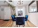 Dining area with seating for four, hardwood floors, and a chandelier at 2557 S Dover St # 30, Lakewood, CO 80227