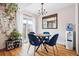 Cozy dining room featuring stylish lighting, modern furniture and hardwood flooring at 2557 S Dover St # 30, Lakewood, CO 80227