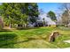 Well-manicured lawn and mature trees frame this charming townhouse with brick accents at 2557 S Dover St # 30, Lakewood, CO 80227