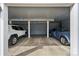 Spacious two-car garage with ample room for parking and storage at 2557 S Dover St # 30, Lakewood, CO 80227