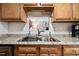 Kitchen features stainless steel sink, granite counters, and abundant cabinet space at 2557 S Dover St # 30, Lakewood, CO 80227